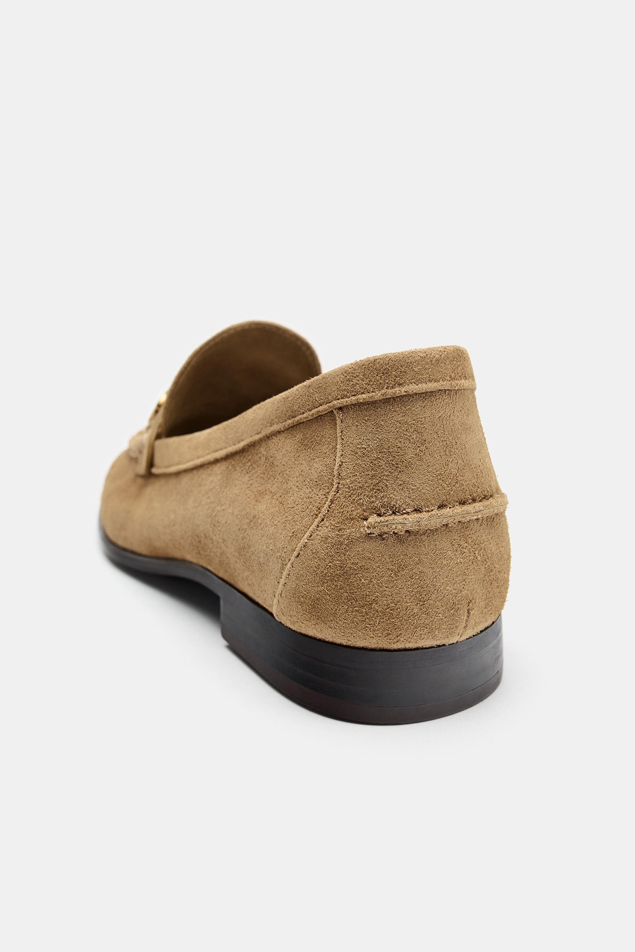 SUEDE LOAFERS WITH METALLIC APPLIQUÉ